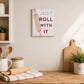 Wooden kitchen quote wall plaque with “Just Roll With It” lettering and rolling pin design