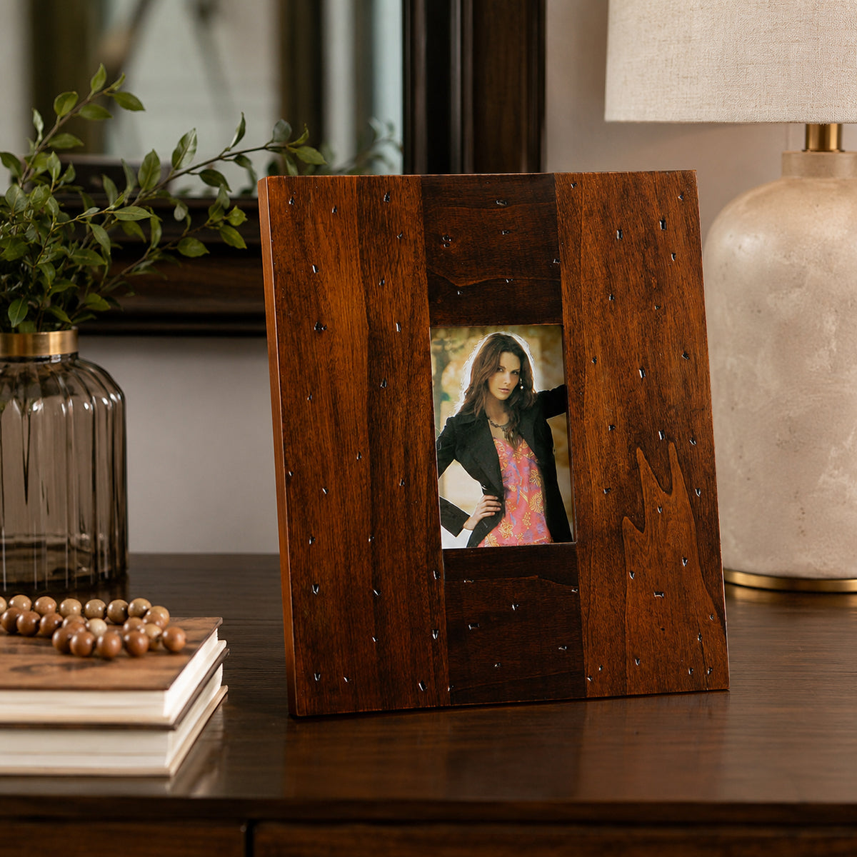 Wooden 8x10 photo frame with rustic finish displayed on side table