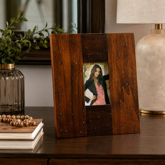 Wooden 8x10 photo frame with rustic finish displayed on side table