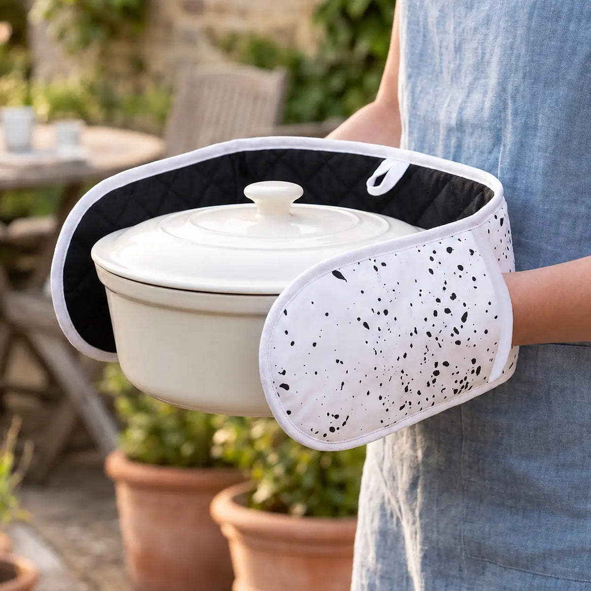 Black and white double oven gloves with heat resistant padding for safe cooking