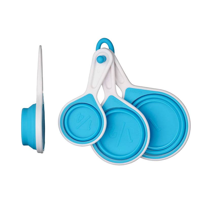 Silicone measuring cups set of 4 in blue collapsed on white background