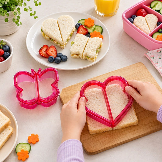Pink butterfly and heart shaped sandwich cutter set used to make fun kids lunchbox sandwiches