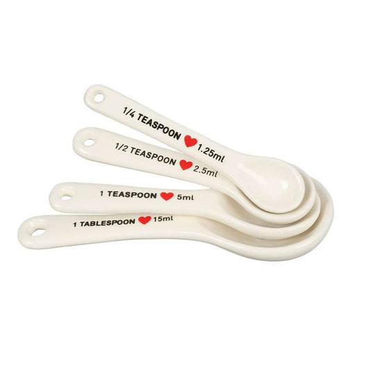 Cream kitchen measuring spoons set of 4 with labeled sizes on white background