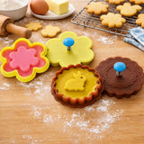 Pink flower and yellow round cookie cutter stamp set with stamped rabbit and flower cookies
