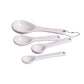 White ceramic measuring spoons set of 4 with hanging ring on white background