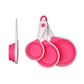 Pink measuring cups set of 4 collapsed and folded on white background