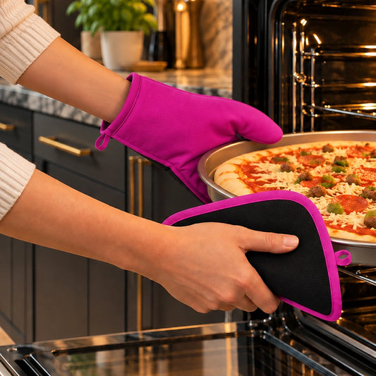 Pink oven glove and pot holder set in use, pulling a pizza out of a hot oven