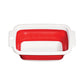 Red and white rectangular collapsible colander shown empty at an angle.