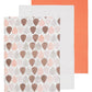 Set of 3 orange cotton kitchen towels including a solid coral orange, plain light grey, and a leaf print design in orange, pink, and brown on white background