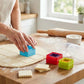 Colourful 5 piece square cookie cutter set with crinkle edges cutting biscuit dough